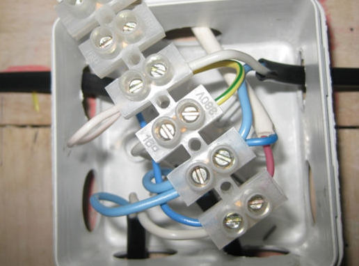 connection of wires with a terminal block in a junction box